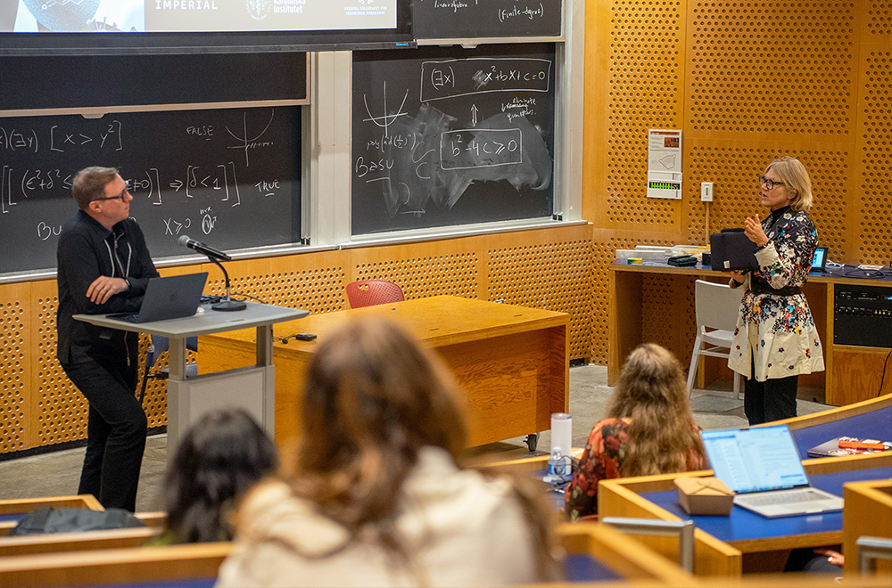 Linda Griffith asks Petter Brodin a question during a presentation in an auditorium