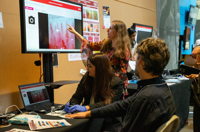 Mikki Tal points to a scan of an event attendee’s capillaries.